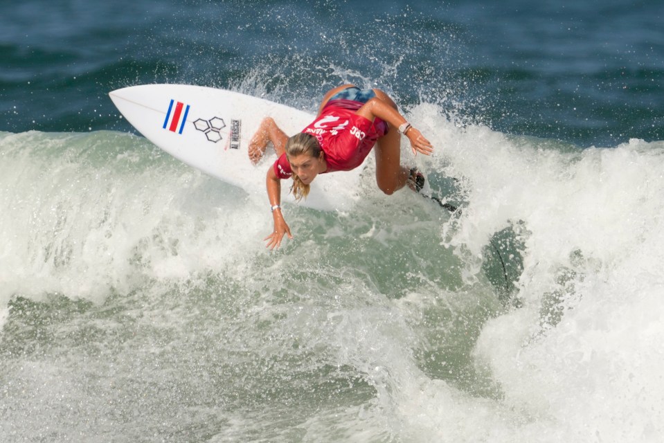 Costa Rica's Leilani McGonagle maneuvers on a wave during the second round of the women's surfing at the 2020 Summer Olympics, Sunday, July 25, 2021, at Tsurigasaki beach in Ichinomiya, Japan. (AP Photo/Francisco Seco)