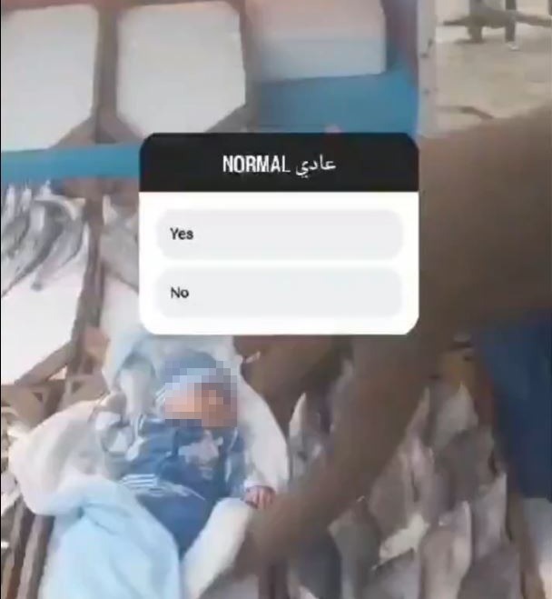 The terrorist supporter had picked the baby up from what appeared to be a box or a cot on the floor