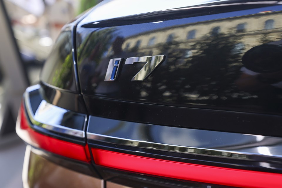 The rear badge of a BMW i7 electric vehicle (EV) at the BMW AG pavilion in the Open Space area during the Munich Motor Show