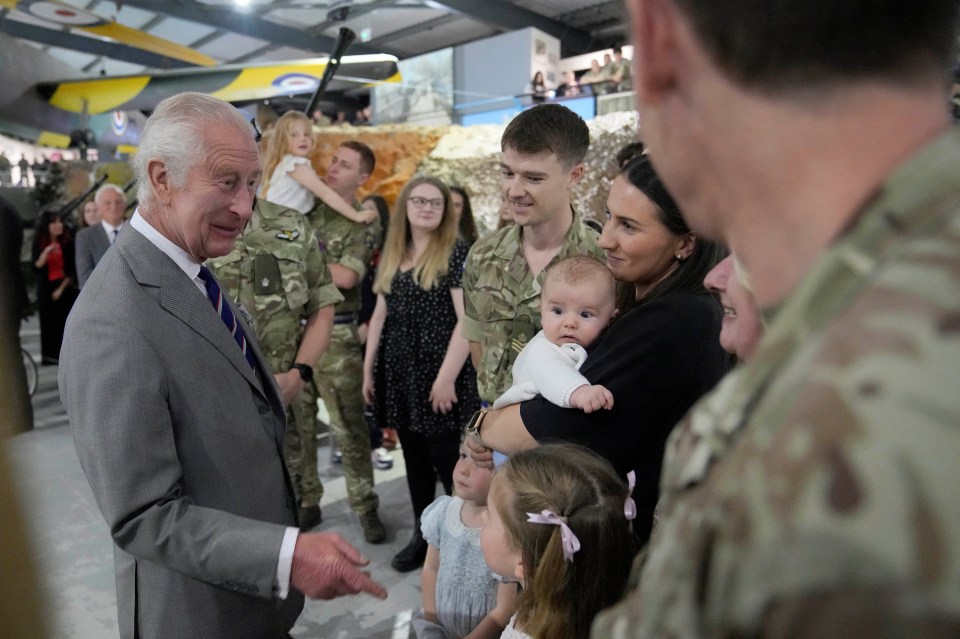The monarch meets staff members and their families at the Army Aviation Centre in Middle Wallop