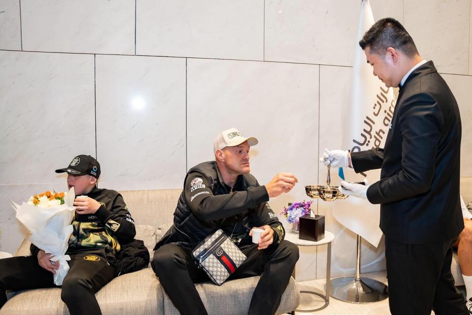 They received bouquets of flowers and hot drinks after their flight
