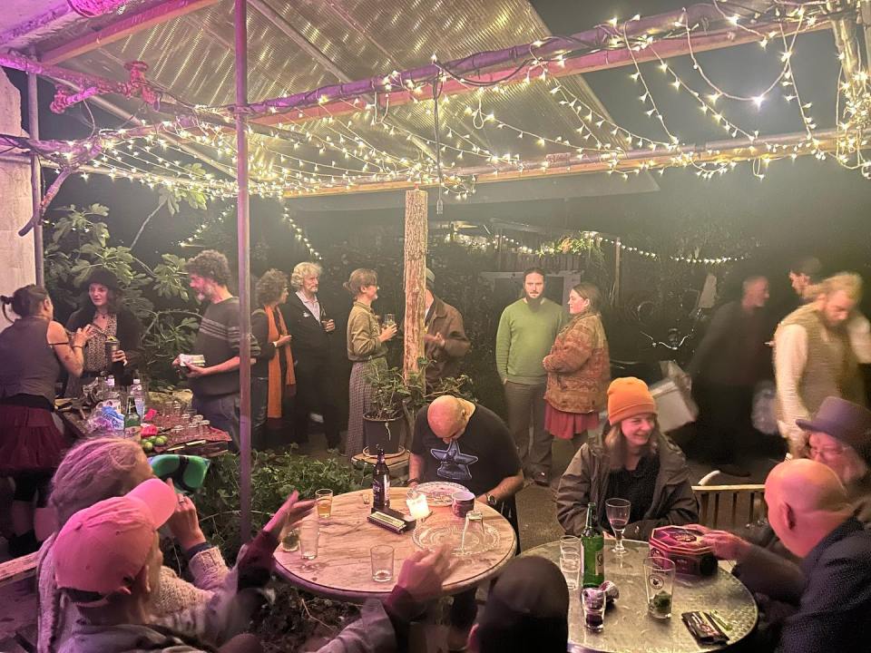 People gather at Glastonbury's ZigZag building premises for a social event
