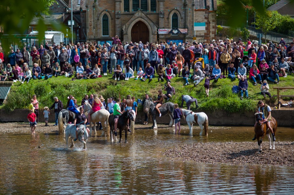 Crowds of spectators stood on the bank by the river on Saturday