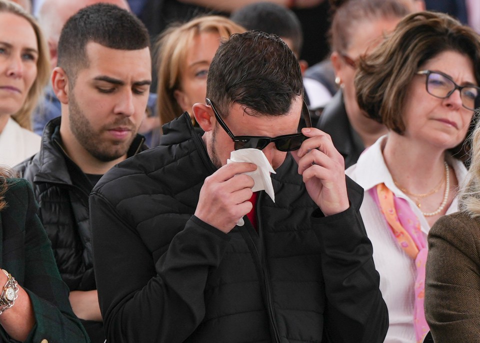 Ian's son Lee wiped his eyes at the vigil
