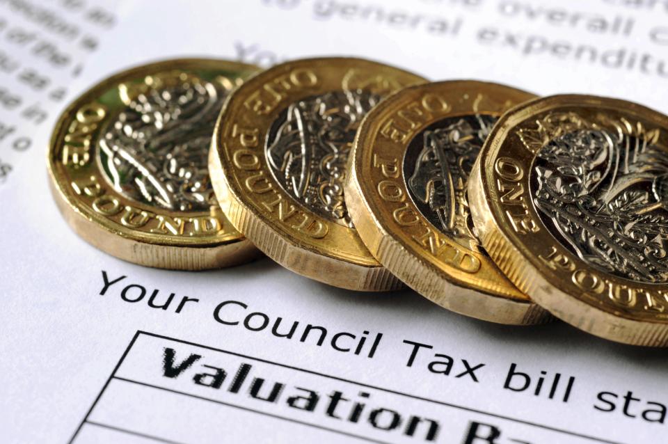 four one pound coins on top of a valuation form