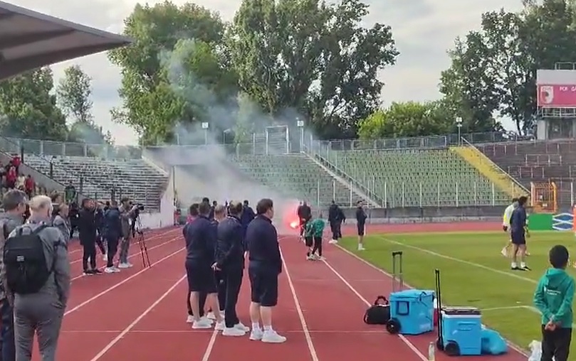 Serbian ultras chucked flares on the pitch at their own team's training session as cops struggled to contain the chaos
