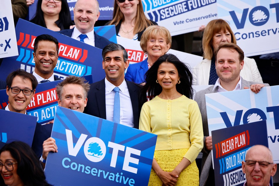 The PM and his wife Akshata Murty pose with supporters