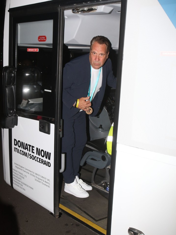 a man is getting off a bus that says donate now