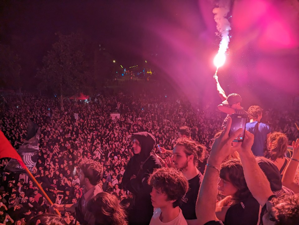 a crowd of people at a concert with a flag that says vikings on it