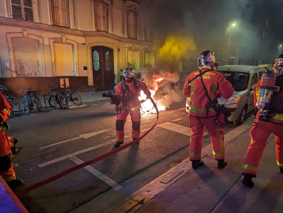 a fireman wearing a helmet with the word ris on it