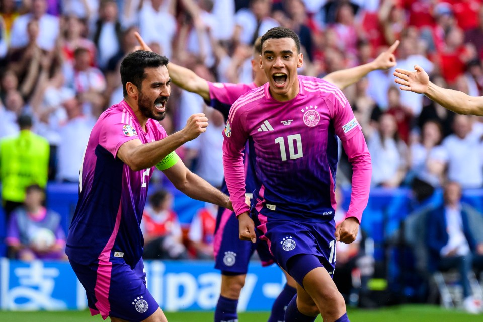 a soccer player wearing a pink shirt with the number 10 on it