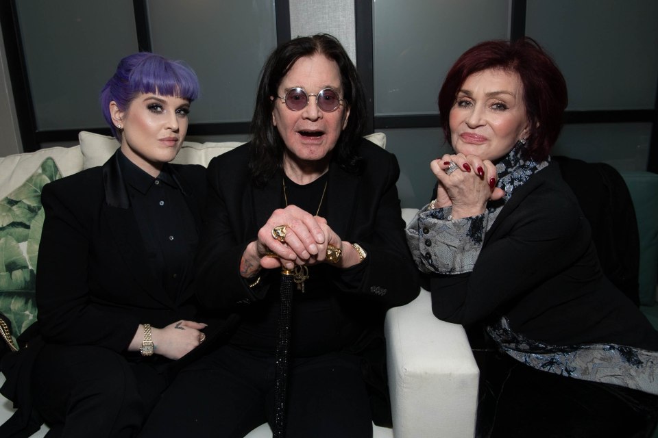 Kelly Osbourne, Ozzy Osbourne, and Sharon Osbourne at an event.