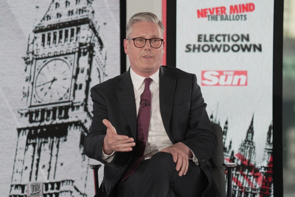 a man sitting in front of a sign that says never mind the ballots