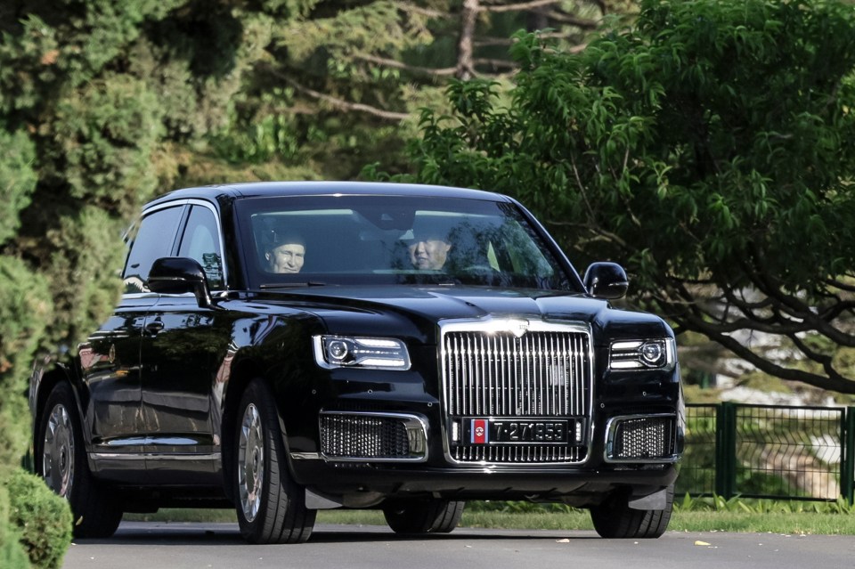 a black car with a license plate that says t21 883