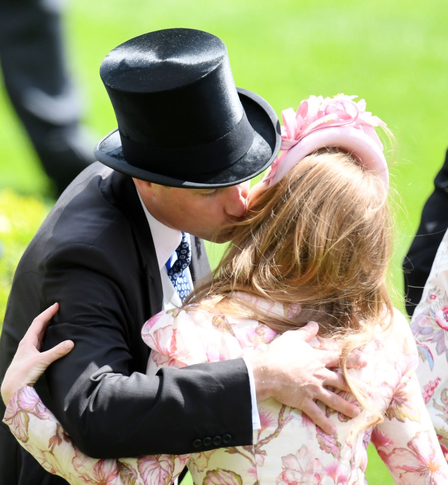 Prince William gives Princess Beatrice a kiss at Ascot