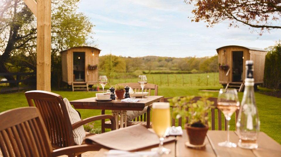 The garden has two shepherd's huts that people can dine in
