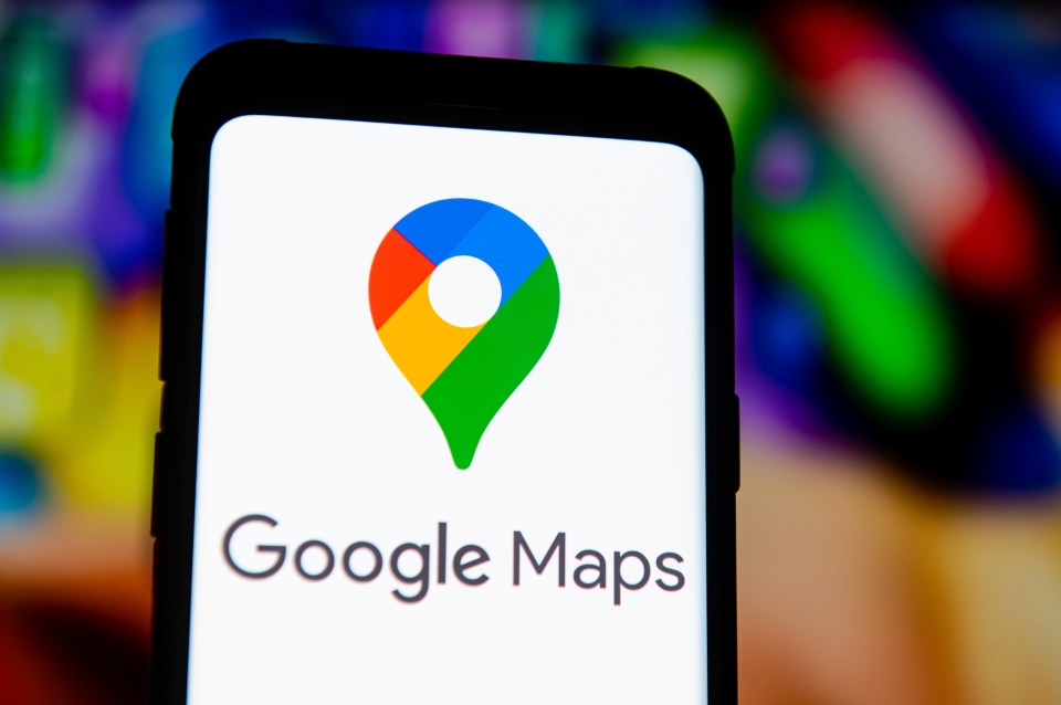 Photo illustration of the Google Maps logo on a smartphone screen.