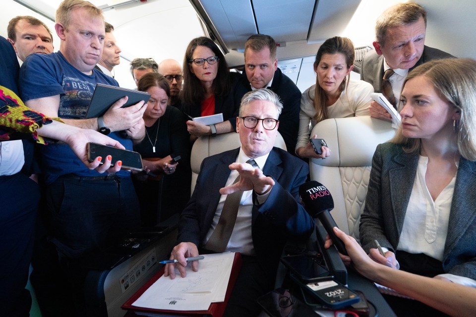 Sir Keir talks to journalists as he travels onboard a plane to Washington DC to attend the Nato summit