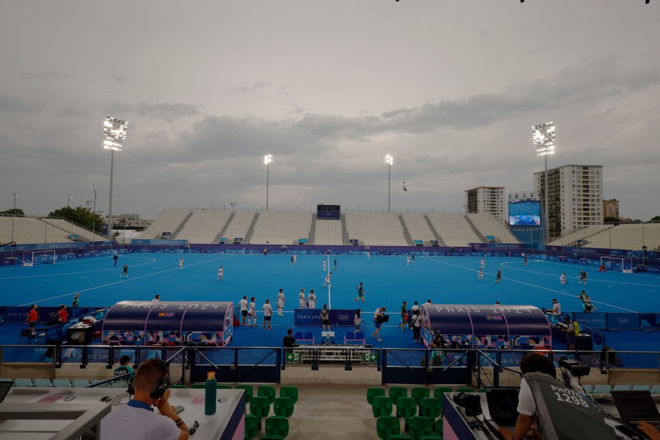 a field hockey game is being played at the tokyo olympics
