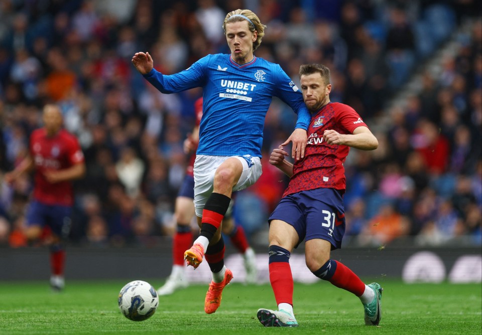 a soccer player in a blue jersey with the word unibet on it
