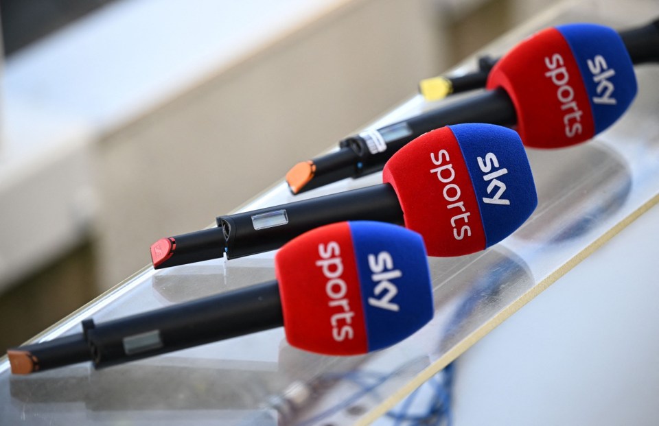 three sky sports microphones are lined up on a table