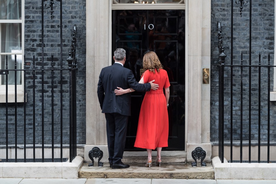LONDON, UNITED KINGDOM - JULY 05: Leader of the Labour Party Sir Keir Starmer and his wife Victoria enter 10 Downing Street after being appointed Britain's 58th prime minister following a landslide general election victory in London, United Kingdom on July 05, 2024. (Photo by Wiktor Szymanowicz/Anadolu via Getty Images)