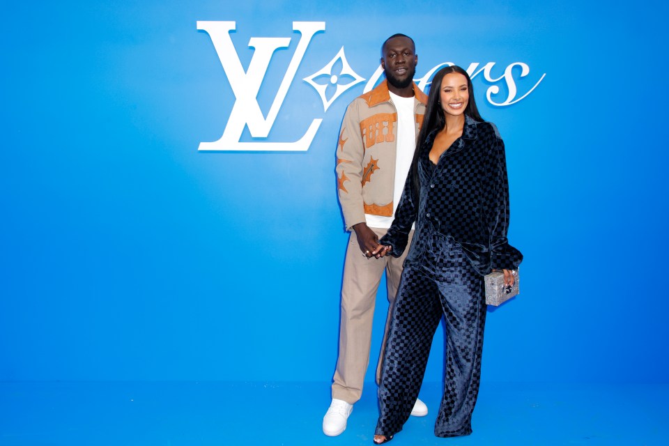 PARIS, FRANCE - JUNE 18: (EDITORIAL USE ONLY - For Non-Editorial use please seek approval from Fashion House) Stormzy and Maya Jama attend the Louis Vuitton Menswear Spring/Summer 2025 show as part of Paris Fashion Week on June 18, 2024 in Paris, France. (Photo by Julien M. Hekimian/Getty Images)
