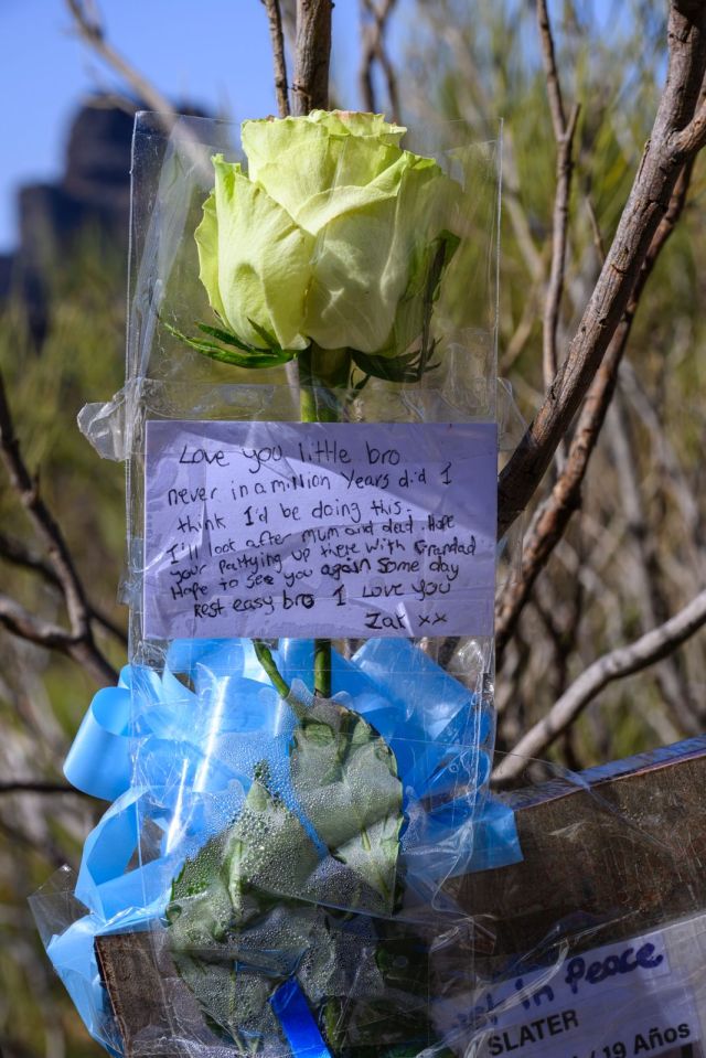a flower with a note attached to it that says " love you little bro "