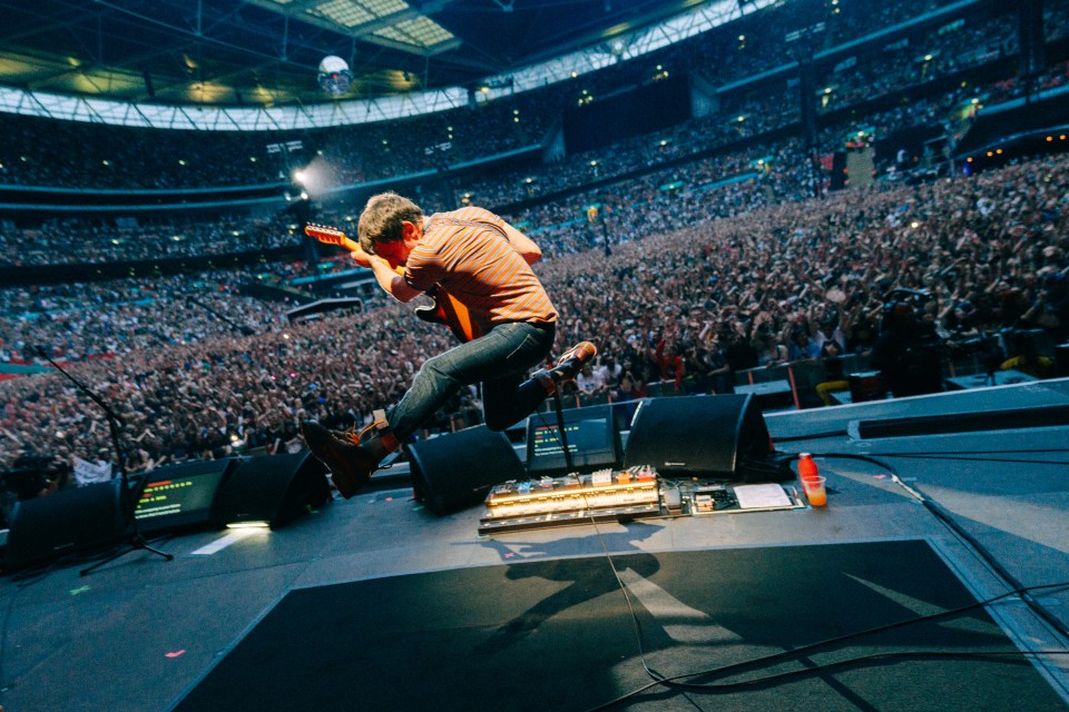 Graham Coxon gives it his all at Blur’s Wembley Stadium gigs last summer
