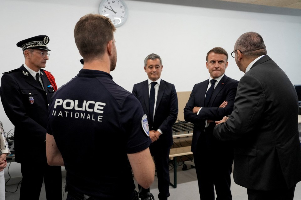 FILE PHOTO: French President Emmanuel Macron and Interior Minister Gerald Darmanin listen to Paris police Prefect Laurent Nunez on a visit to the police station of the Olympic village for the 2024 Summer Olympics, in Paris, France, July 22, 2024. Michel Euler/Pool via REUTERS/File Photo
