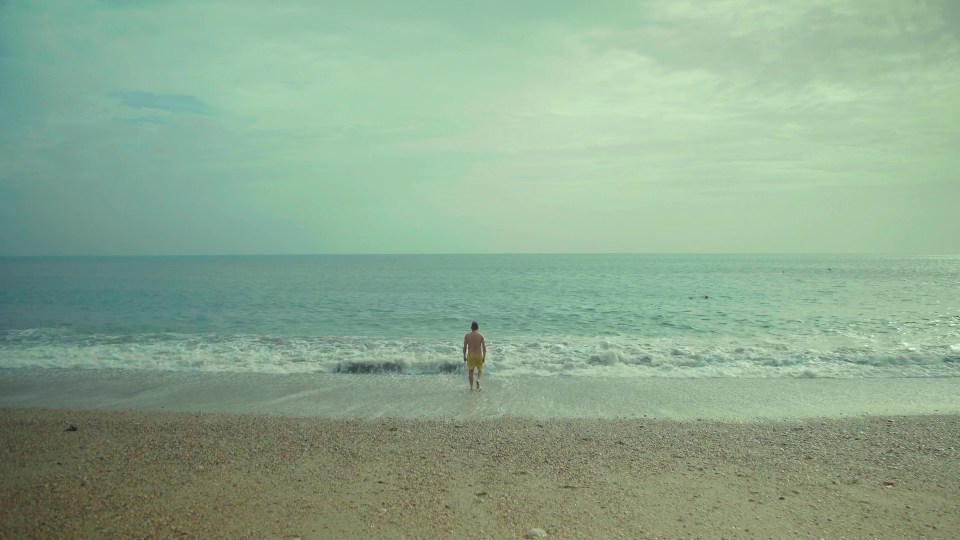 Damon takes a dip in the sea as the film draws to a close