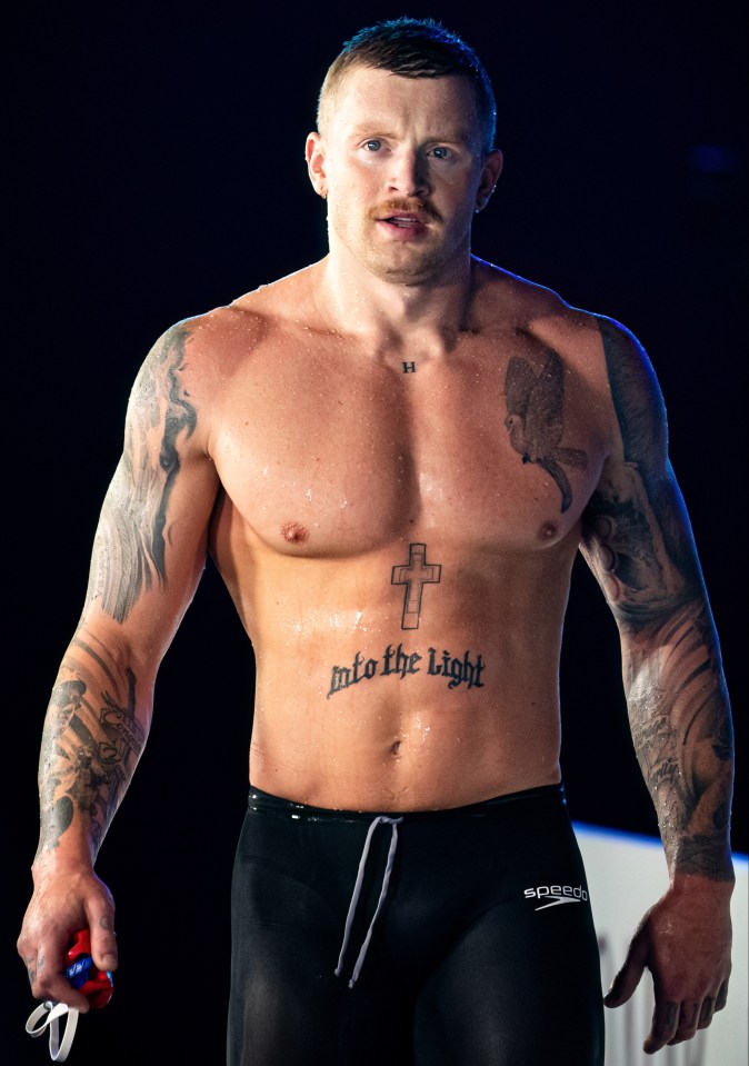 a man with a tattoo on his chest that says into the light