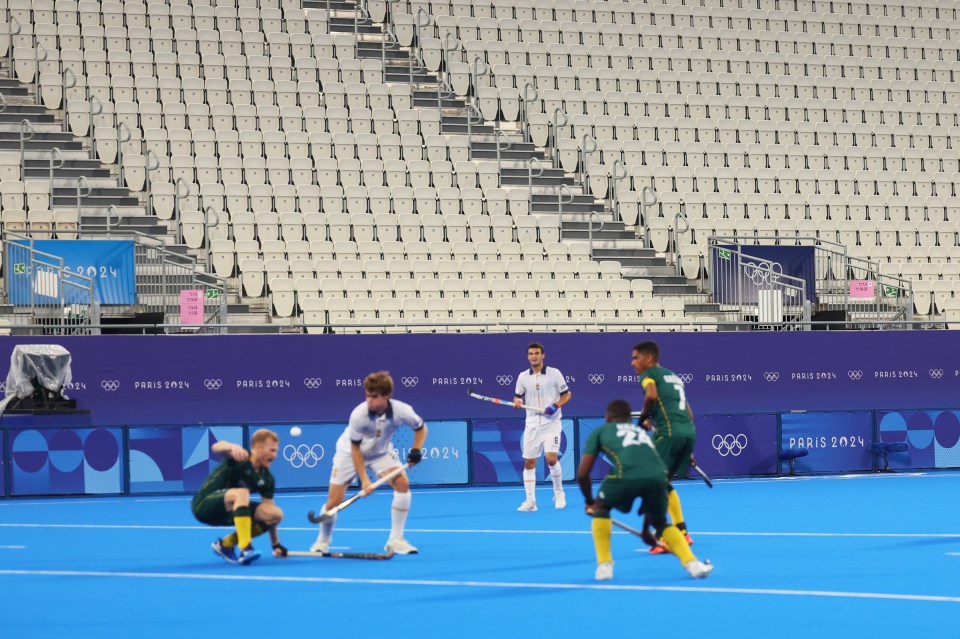 a field hockey game is being played at the paris olympics