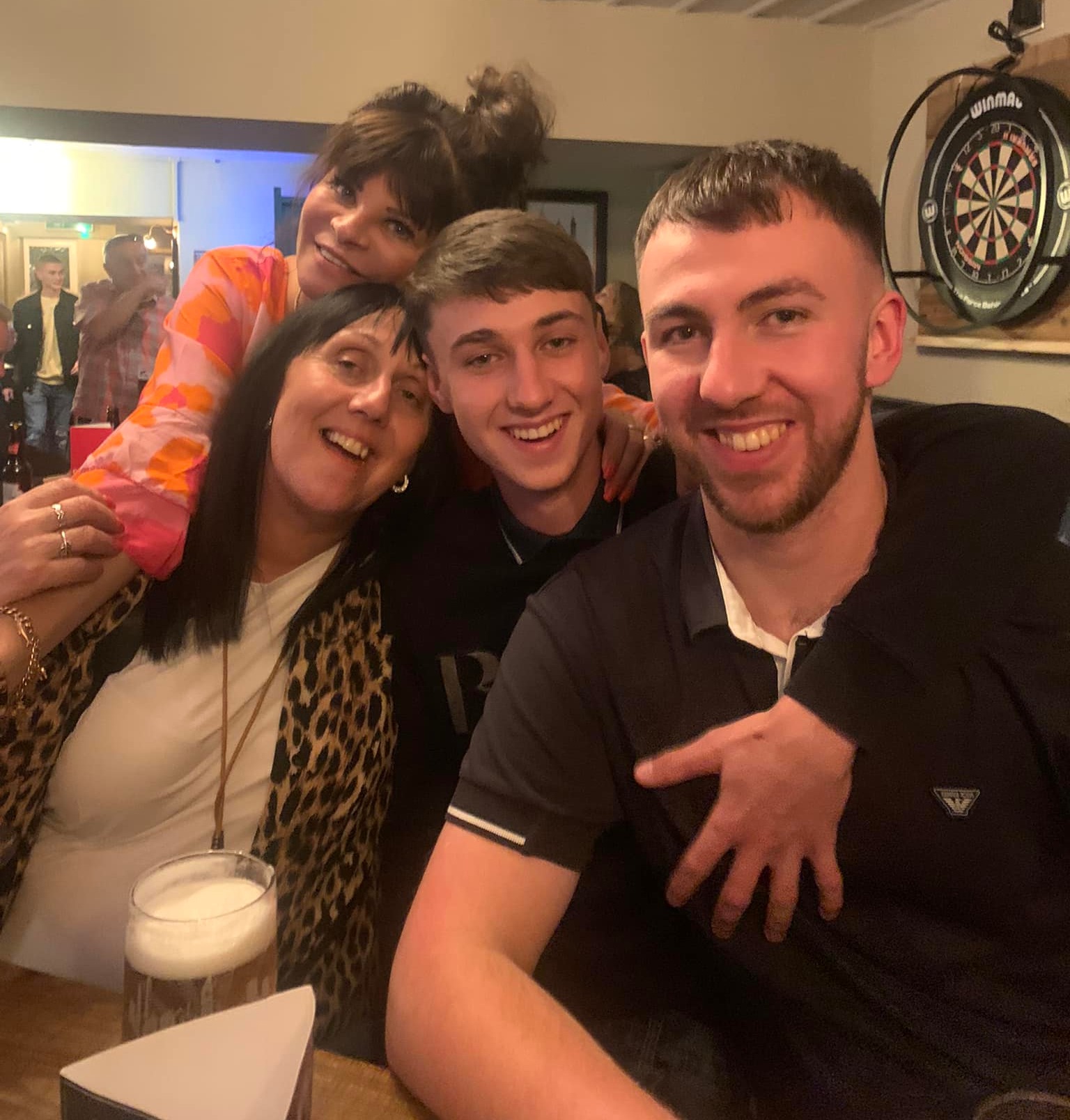 Jay pictured with his mum and brother