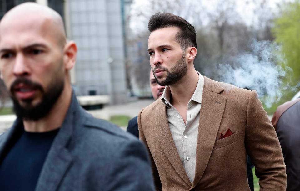 a man with a beard wears a brown jacket