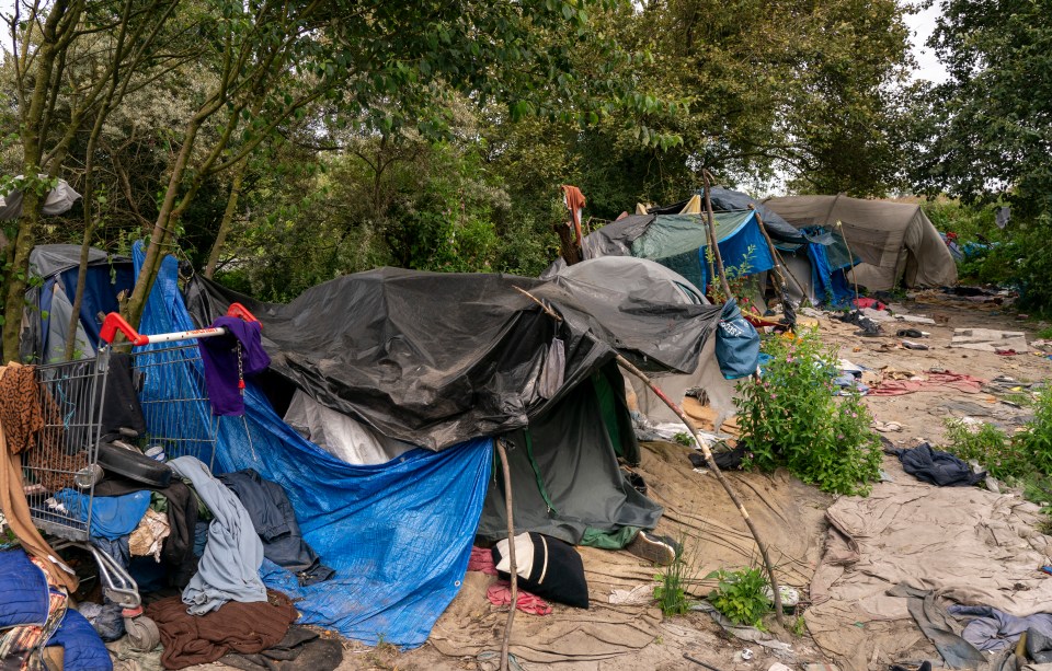 Tents and makeshift facilities at a camp in Loon-Plage