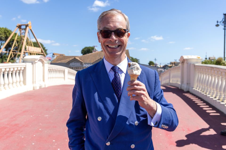 a man in a blue suit holds an ice cream cone