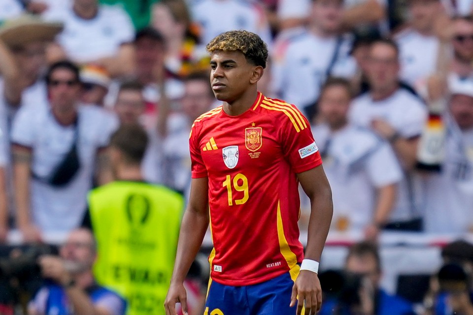 a soccer player wearing a red jersey with the number 19 on it