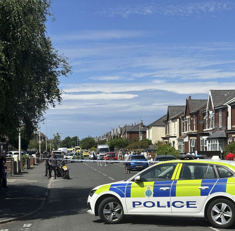 a police car is parked on the side of the road