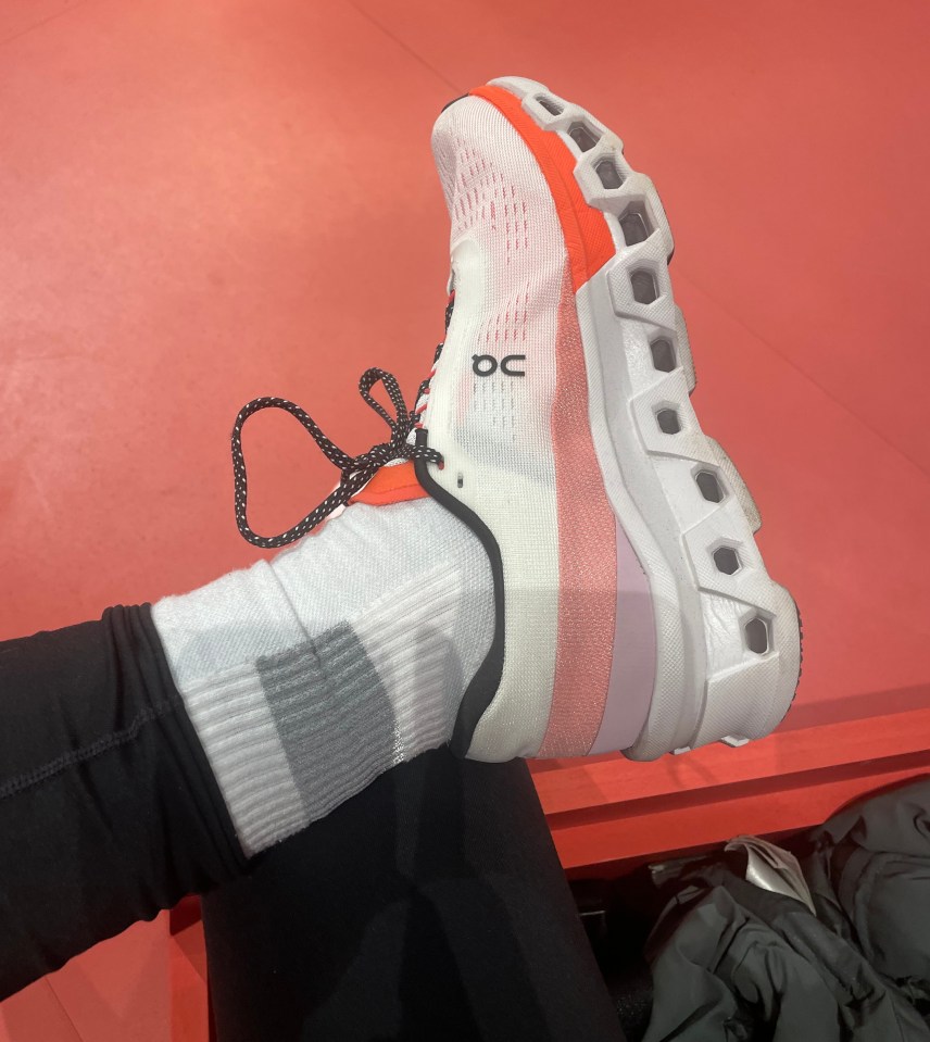 a person wearing a pair of on cloud running shoes