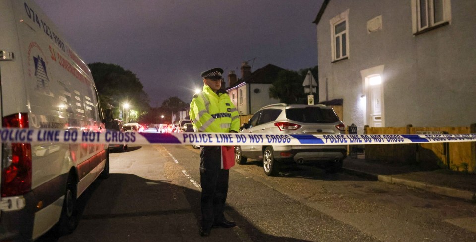 a police officer stands behind a police line that says police line do not cross