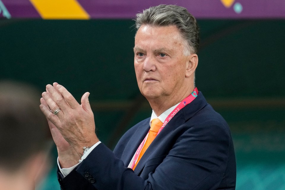 a man in a suit and tie with a lanyard around his neck that says uefa euro 2020