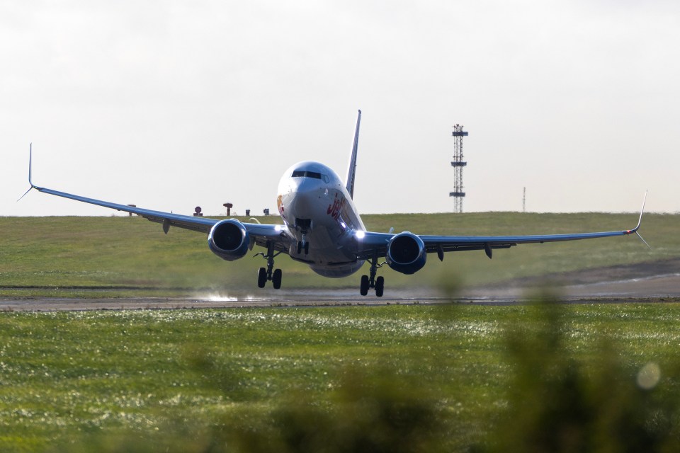 an air canada plane is taking off from a runway