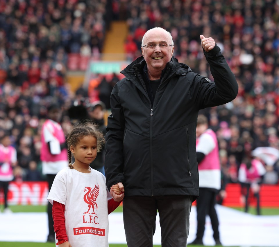 a man holds hands with a little girl wearing a shirt that says lfc foundation