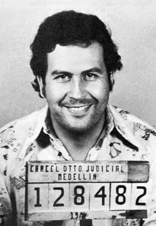 a black and white photo of a man with the number 128482