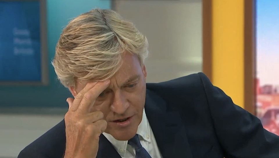 a man in a suit and tie is on a good morning britain show