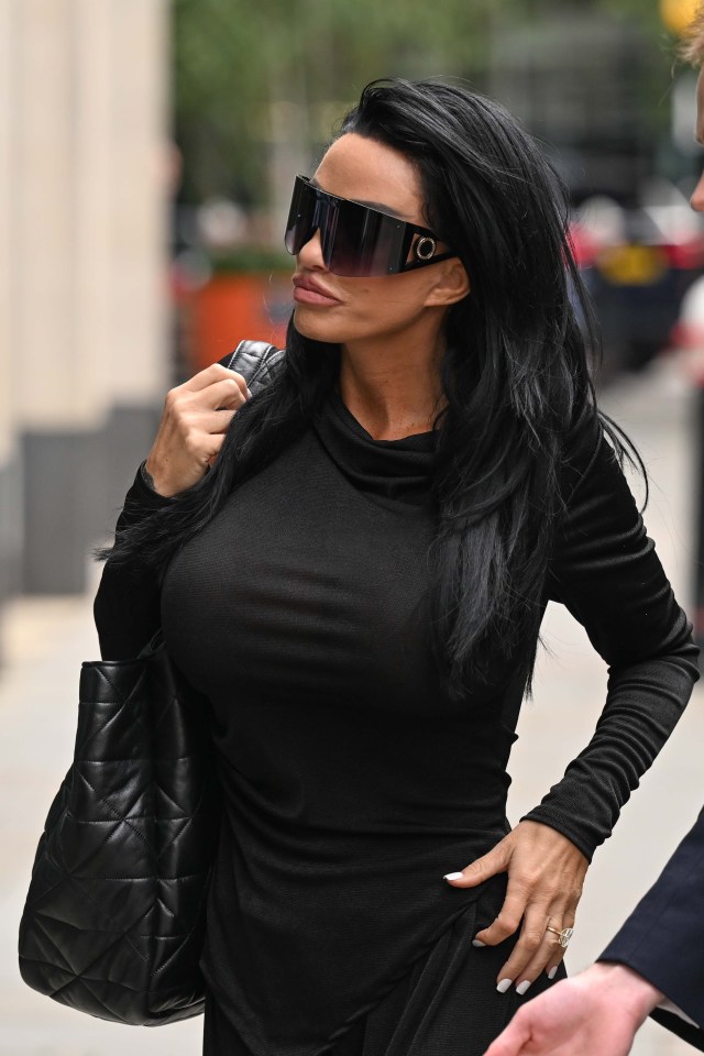a woman wearing sunglasses and a black purse