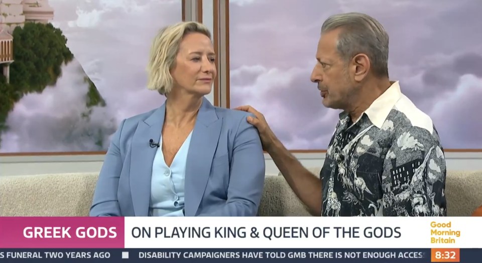a man and woman are on a good morning britain show