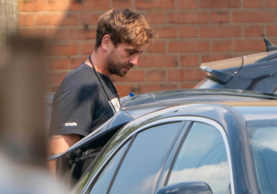 a man wearing a black t-shirt with the word truth on it