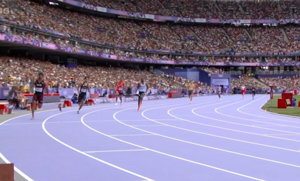 a group of athletes are running on a track with a bbc logo in the background